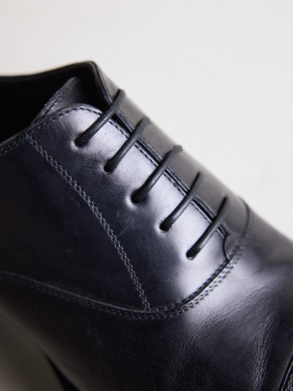 Close-up of the lacing on the black calf leather oxford